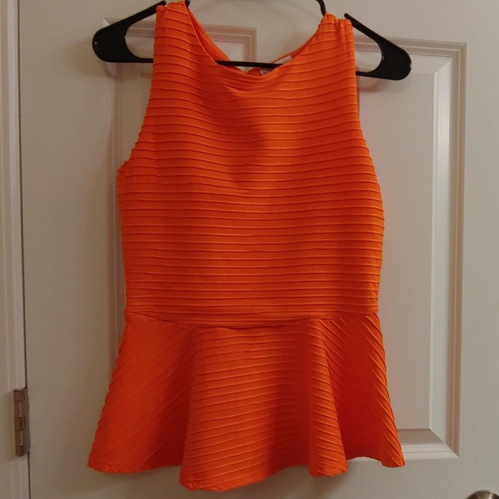 Bisou Bisou orange shirt.